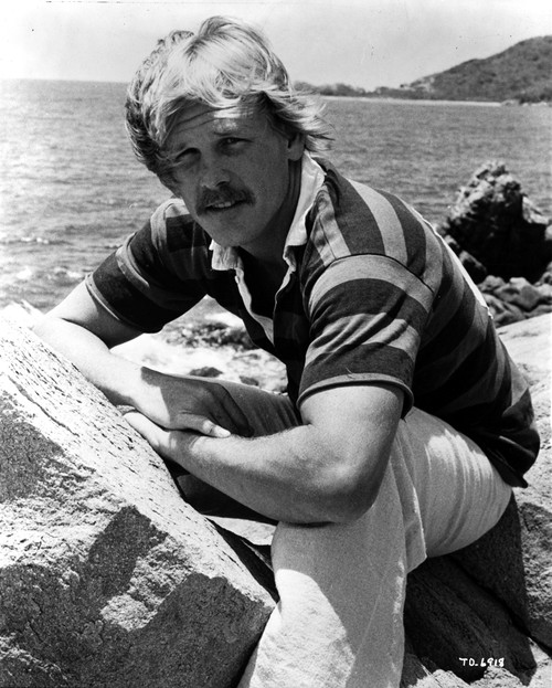 Nick Nolte wearing a striped shirt at the beach Photo Print - Item # VARCEL684493
