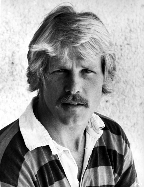 Nick Nolte wearing a striped polo shirt Photo Print - Item # VARCEL684494