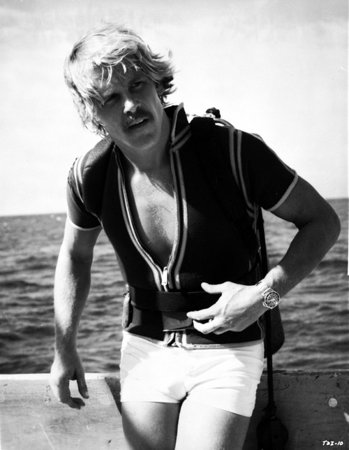 Nick Nolte swearing shorts on a boat Photo Print - Item # VARCEL684497