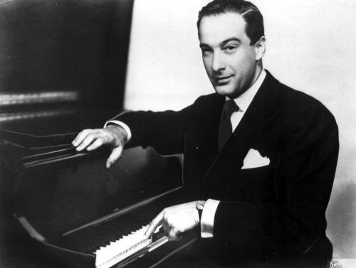 Victor Borge with a piano Photo Print - Item # VARCEL684527