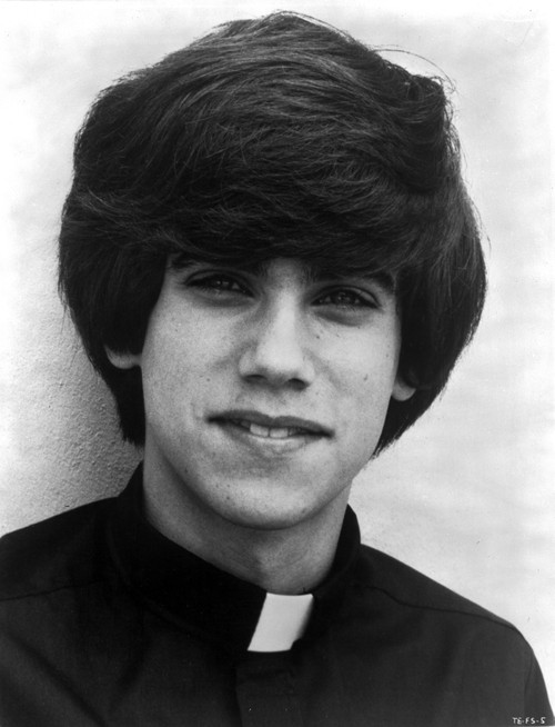Robby Benson wearing a clerical collar Photo Print - Item # VARCEL684536