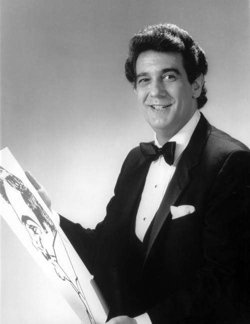Placido Domingo holding a painting Photo Print - Item # VARCEL684632