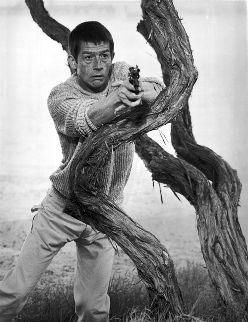 Film still featuring John Hurt with a gun Photo Print - Item # VARCEL684645