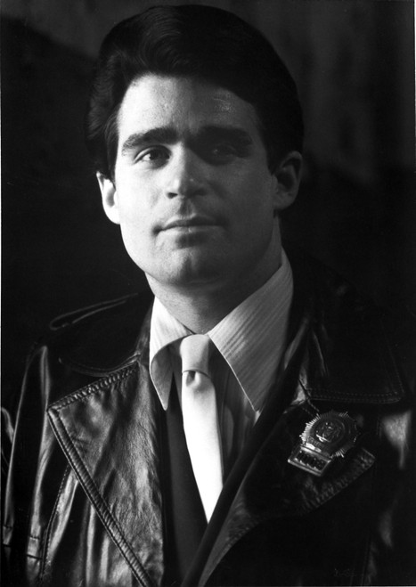 Treat Williams wearing a leather jacket and a police badge Photo Print - Item # VARCEL684729