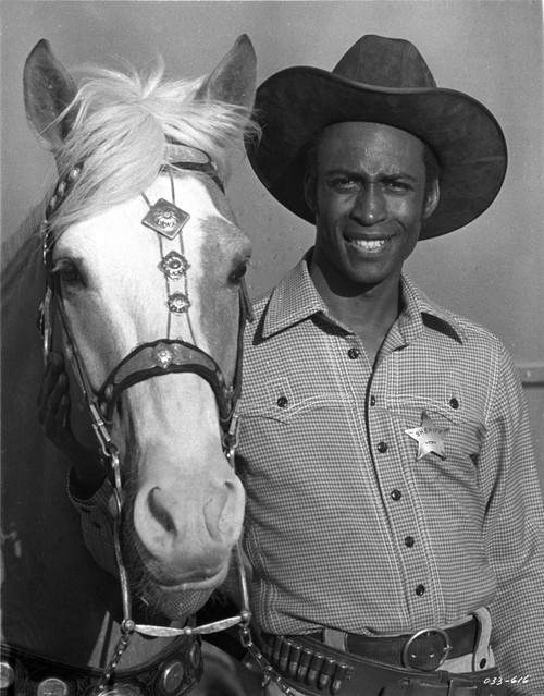 Cleavon Little wearing a cowboy outfit with a horse Photo Print - Item # VARCEL684828