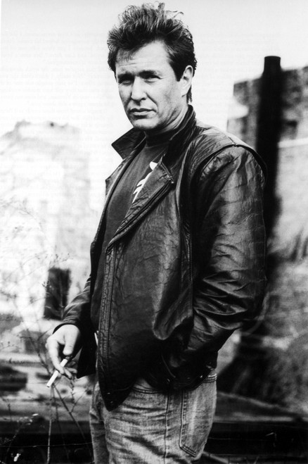 Film still of Tom Berenger wearing a leather jacket outdoors Photo Print - Item # VARCEL684921