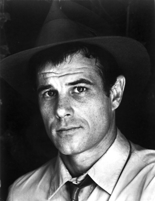 Brad Davis wearing a fedora Photo Print - Item # VARCEL684935