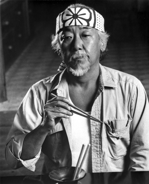 Film still of Pat Morita eating with chopsticks Photo Print - Item # VARCEL684971