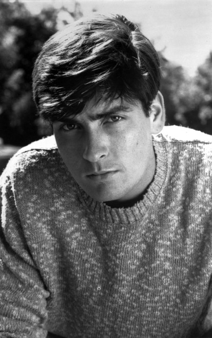 Charlie Sheen wearing a sweater outdoors Photo Print - Item # VARCEL684979