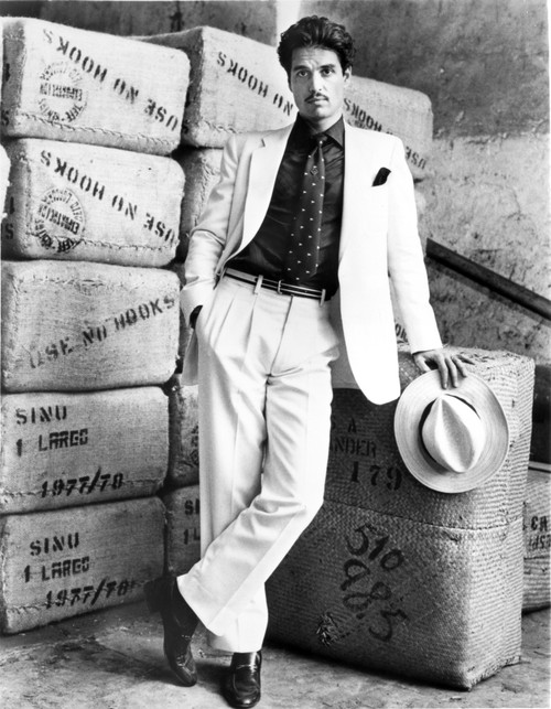 Chris Sarandon wearing a suit with stacked boxes Photo Print - Item # VARCEL684977