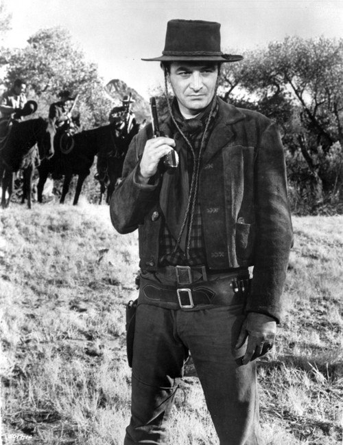 Film still of Robert Loggia wearing a cowboy costume and carrying a pistol Photo Print - Item # VARCEL685022