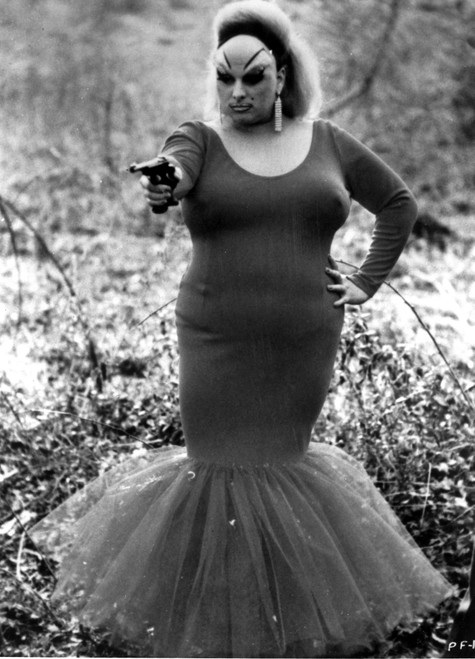 Divine pointing a gun Photo Print - Item # VARCEL685042