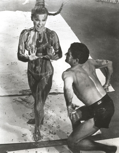 Ann-Margaret wearing a bikini beside a dancing man Photo Print - Item # VARCEL685504