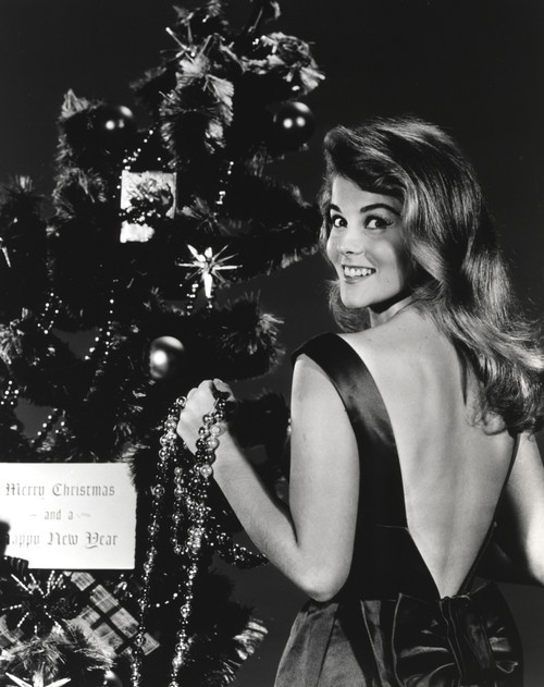 Ann-Margaret beside a Christmas tree Photo Print - Item # VARCEL685515