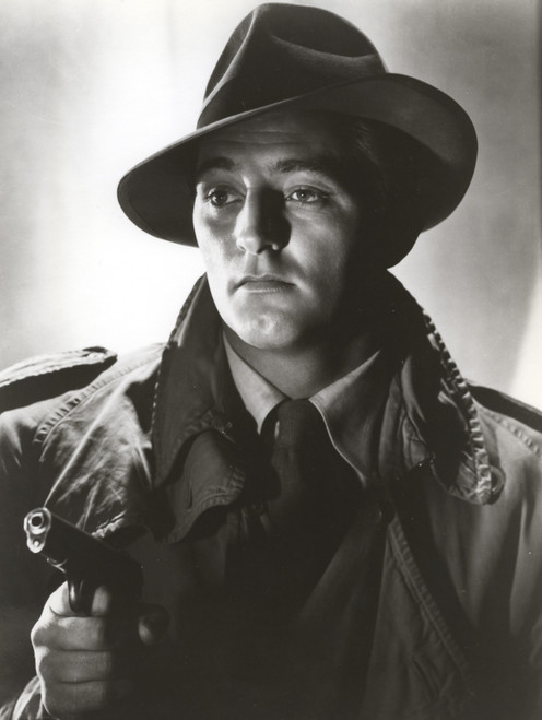Robert Mitchum holding a gun Photo Print - Item # VARCEL686048