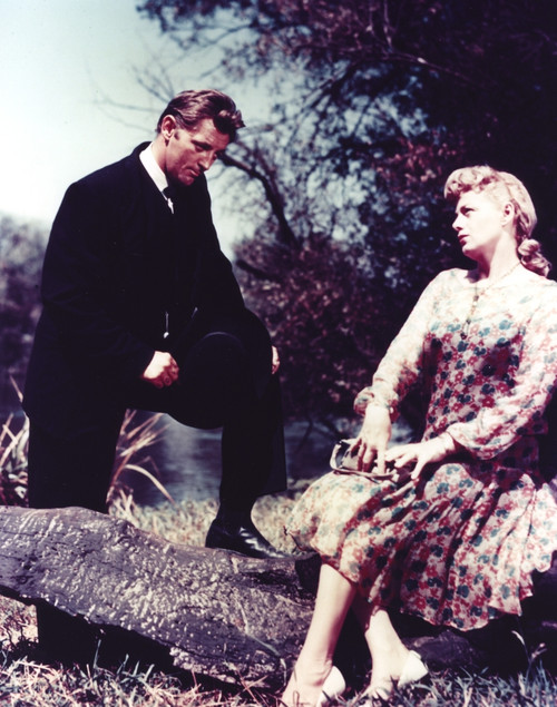 Film still featuring Robert Mitchum with a woman Photo Print - Item # VARCEL686091