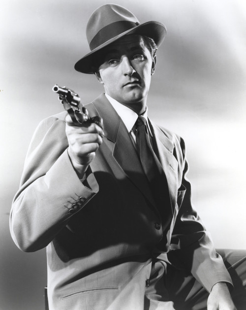 Film still featuring Robert Mitchum holding a gun Photo Print - Item # VARCEL686097