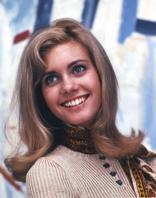Olivia John smiling in Brown Sweater Photo Print - Item # VARCEL686406