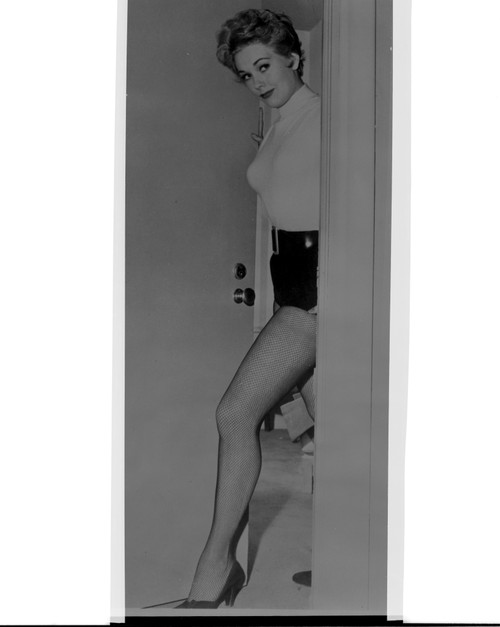Kim Novak posing in a doorway Photo Print - Item # VARCEL686484