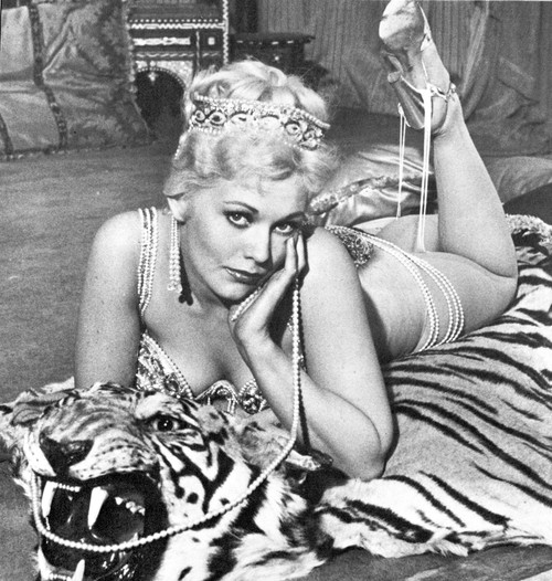 Kim Novak lying on a tiger skin rug Photo Print - Item # VARCEL686501