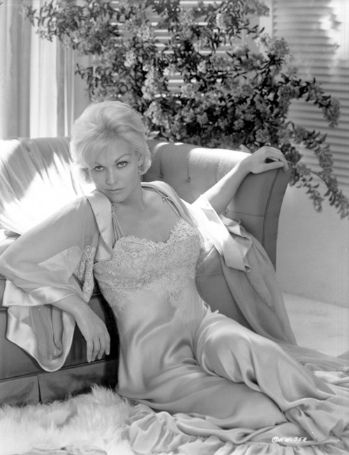Kim Novak leaning on a sofa Photo Print - Item # VARCEL686521