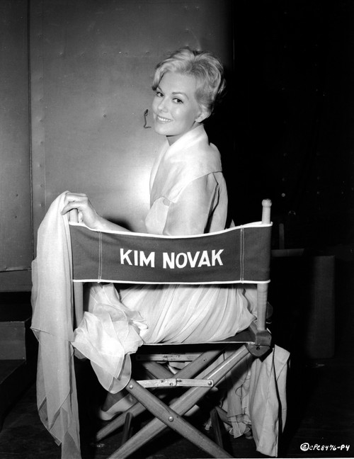 Kim Novak Siting on Chair in White Gown Photo Print - Item # VARCEL686522