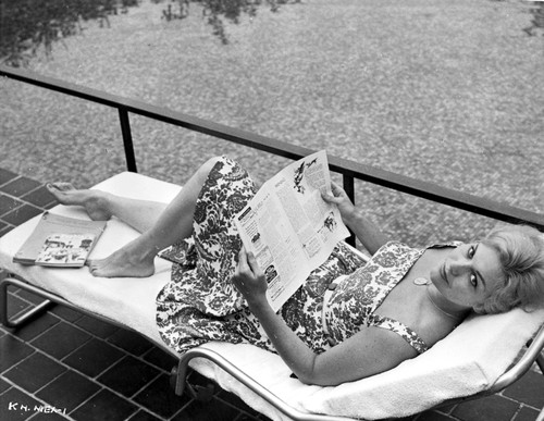 Kim Novak Lying on Bench in Flower Design Dress Photo Print - Item # VARCEL686531