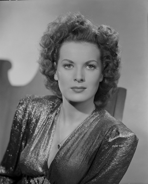 Maureen O'Hara in Black Gown Portrait wearing Shiny Blouse on a Chair Photo Print - Item # VARCEL686671