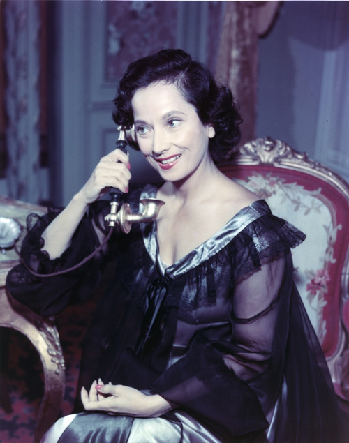 Merle Oberon in Black Gown With Telephone Portrait Photo Print - Item # VARCEL686712