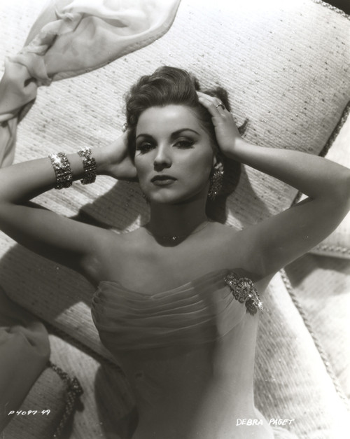 Debra Paget lying on a bed Photo Print - Item # VARCEL686795