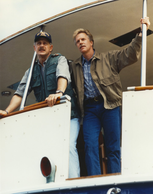Jameson Parker standing in Brown Jacket and Blue Stripe Collar Shirt with Blue Jeans Photo Print - Item # VARCEL686808