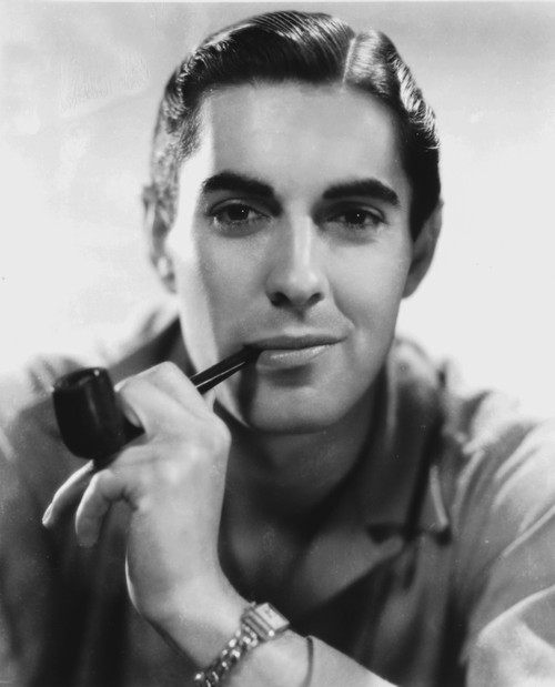 Tyrone Power smoking a pipe Photo Print - Item # VARCEL686920