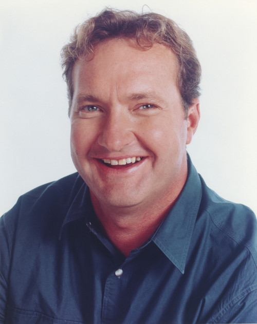 Randy Quaid smiling wearing Blue Polo Portrait with White Background Photo Print - Item # VARCEL686994