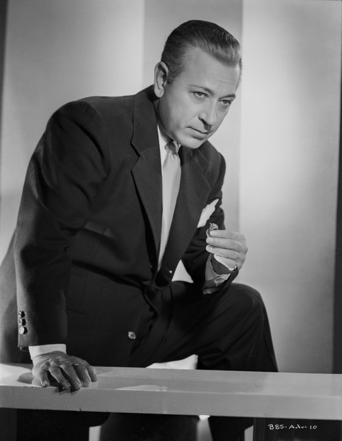 George Raft on the Table in Black Coat and Tie Photo Print - Item # VARCEL687017