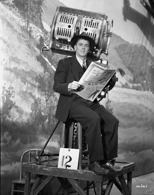 Ronald Reagan Reading Newspaper in Suit Photo Print - Item # VARCEL687034