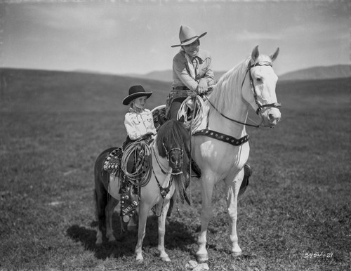Tex Ritter and a girl on horseback Photo Print - Item # VARCEL687115