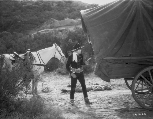 Tex Ritter beside a wagon Photo Print - Item # VARCEL687118