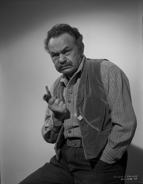 Edward Robinson Holding Pipe in Black and White Photo Print - Item # VARCEL687180