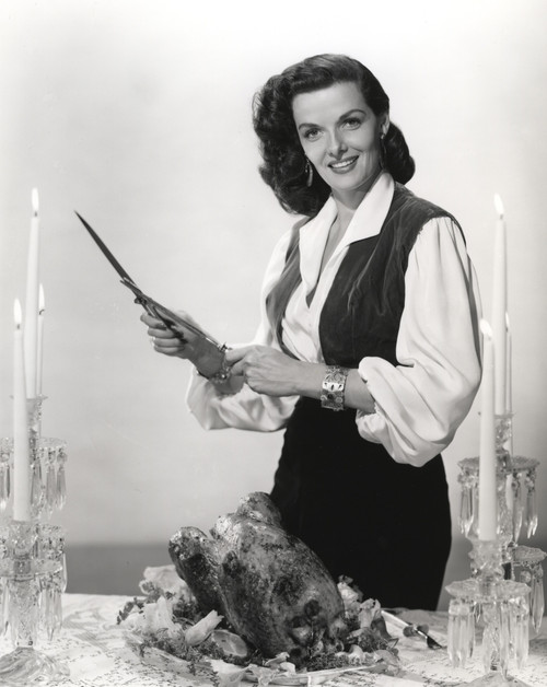 Jane Russell sharpening a knife on Thanksgiving Photo Print - Item # VARCEL687403