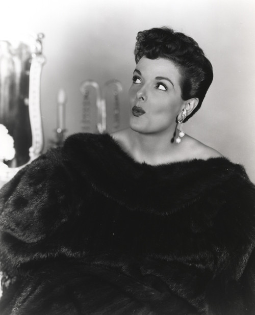 Jane Russell Portrait in Black Fur Pelt Coat and Pearl Earrings while Eyes Looking Up to the Right Photo Print - Item # VARCEL687427