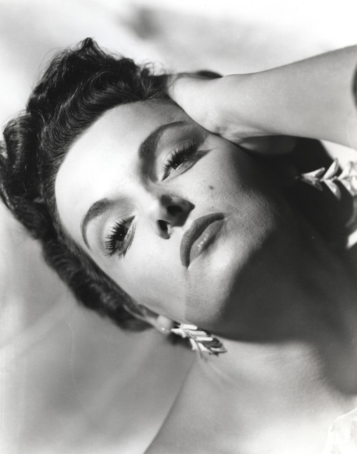 Jane Russell Close Up Portrait in White Lace Dress and Dangling Earrings with Head Leaning on the Left Hand Photo Print - Item # VARCEL687473