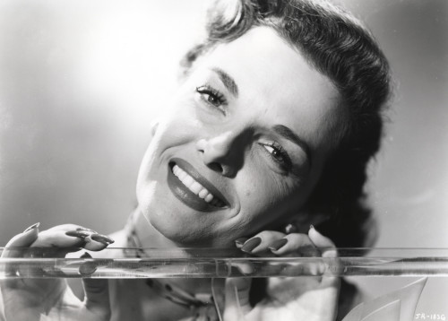 Jane Russell Close Up Portrait in Strap Dress and Neck Ribbon with Hands on the Glass Photo Print - Item # VARCEL687488