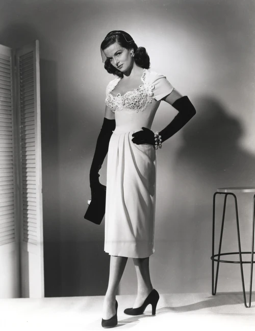Jane Russell Posed in White Silk Shoulder Dress and Black Silk Gloves with Left Hand on the Waist Photo Print