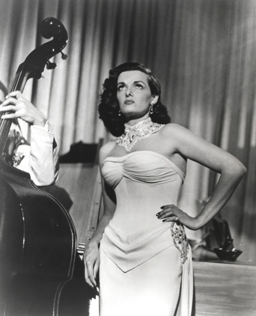 Jane Russell Posed in White Strapless Silk Dress and Necklace with Left Hand on the Waist while Eyes Looking Up Photo Print
