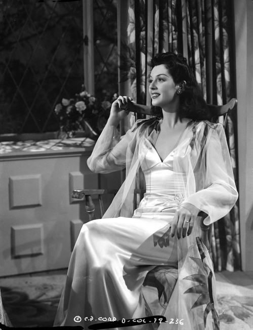Rosalind Russell Seated on Chair in White Gown Photo Print - Item # VARCEL687603