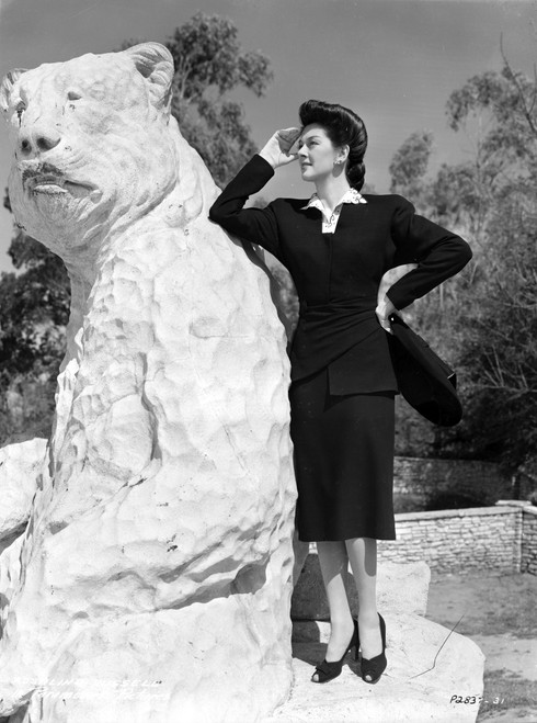 Rosalind Russell Leaning on Bear Statue Photo Print - Item # VARCEL687609