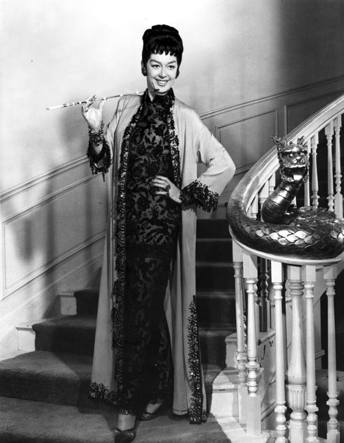 Rosalind Russell Going Down the Stair Case and Holding a Cigarette Photo Print - Item # VARCEL687623