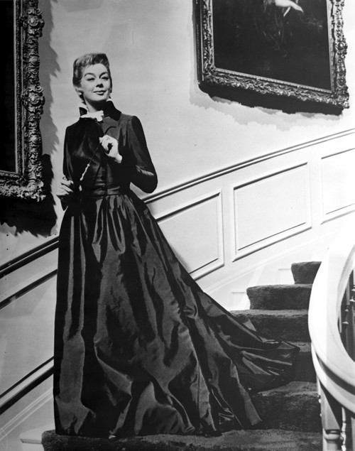 Rosalind Russell Going Down the Stair Case in Gown Photo Print - Item # VARCEL687631