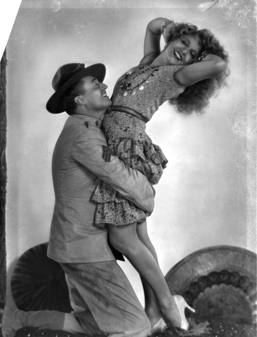 Renee Adoree and a man in military uniform Photo Print - Item # VARCEL687903