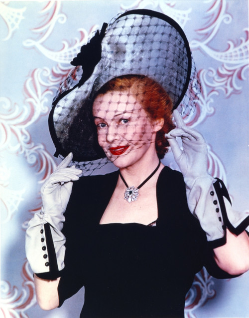 Madeleine Carroll smiling in Black Dress With Hat Photo Print - Item # VARCEL687943